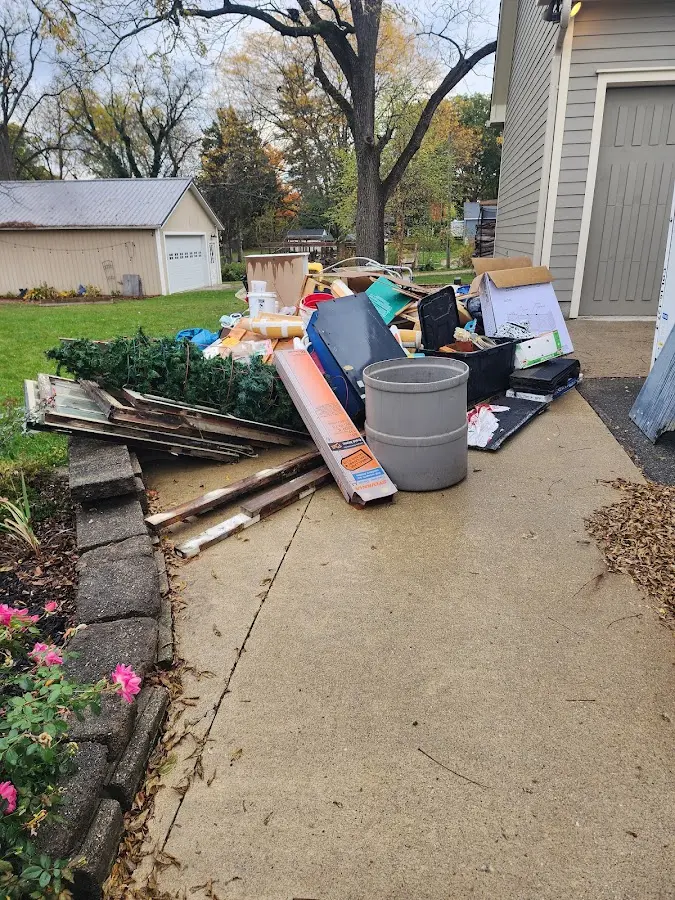 Dumpster being loaded with debris for 30 Yard Dumpster Rental in Los Fresnos